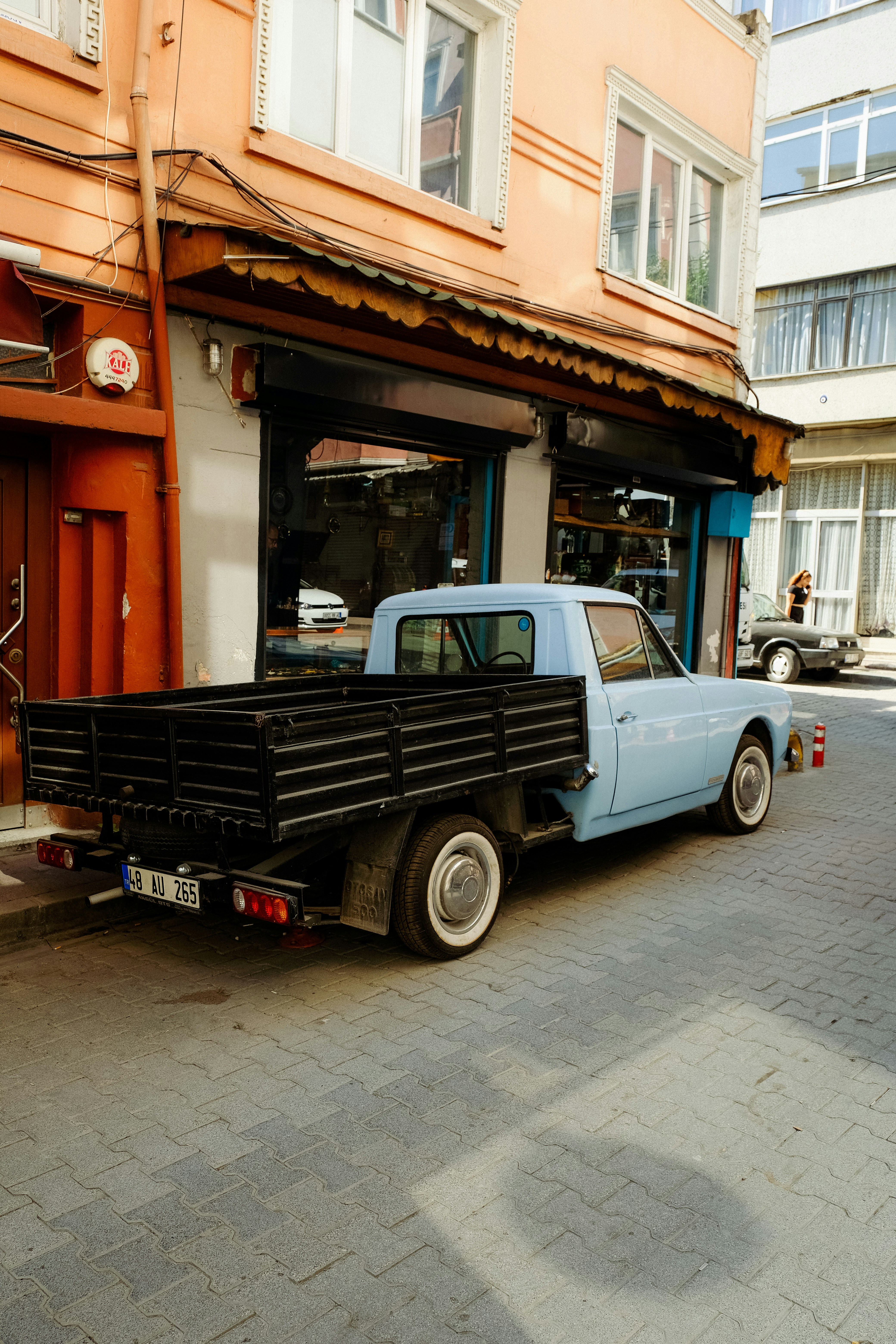 a truck parked in front of a store