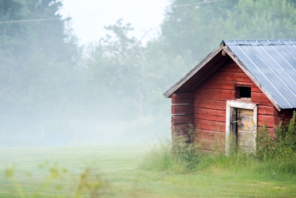 a red barn in a grassy field