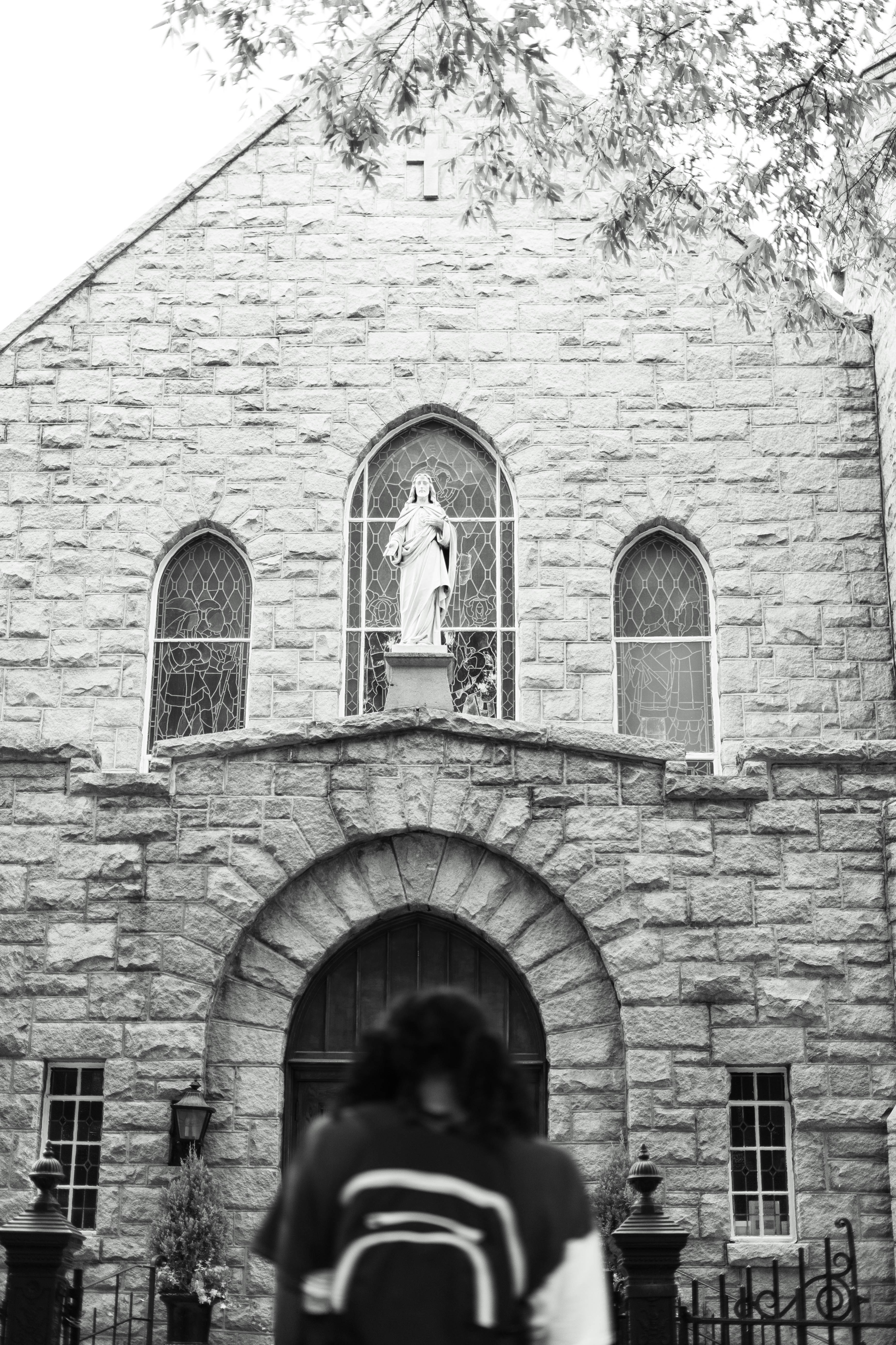 a person standing in front of a statue