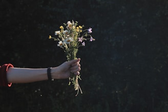 a person holding flowers
