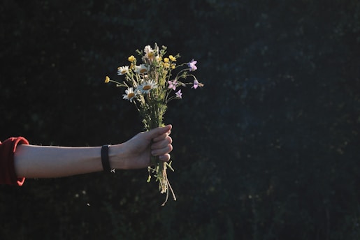 a person holding flowers
