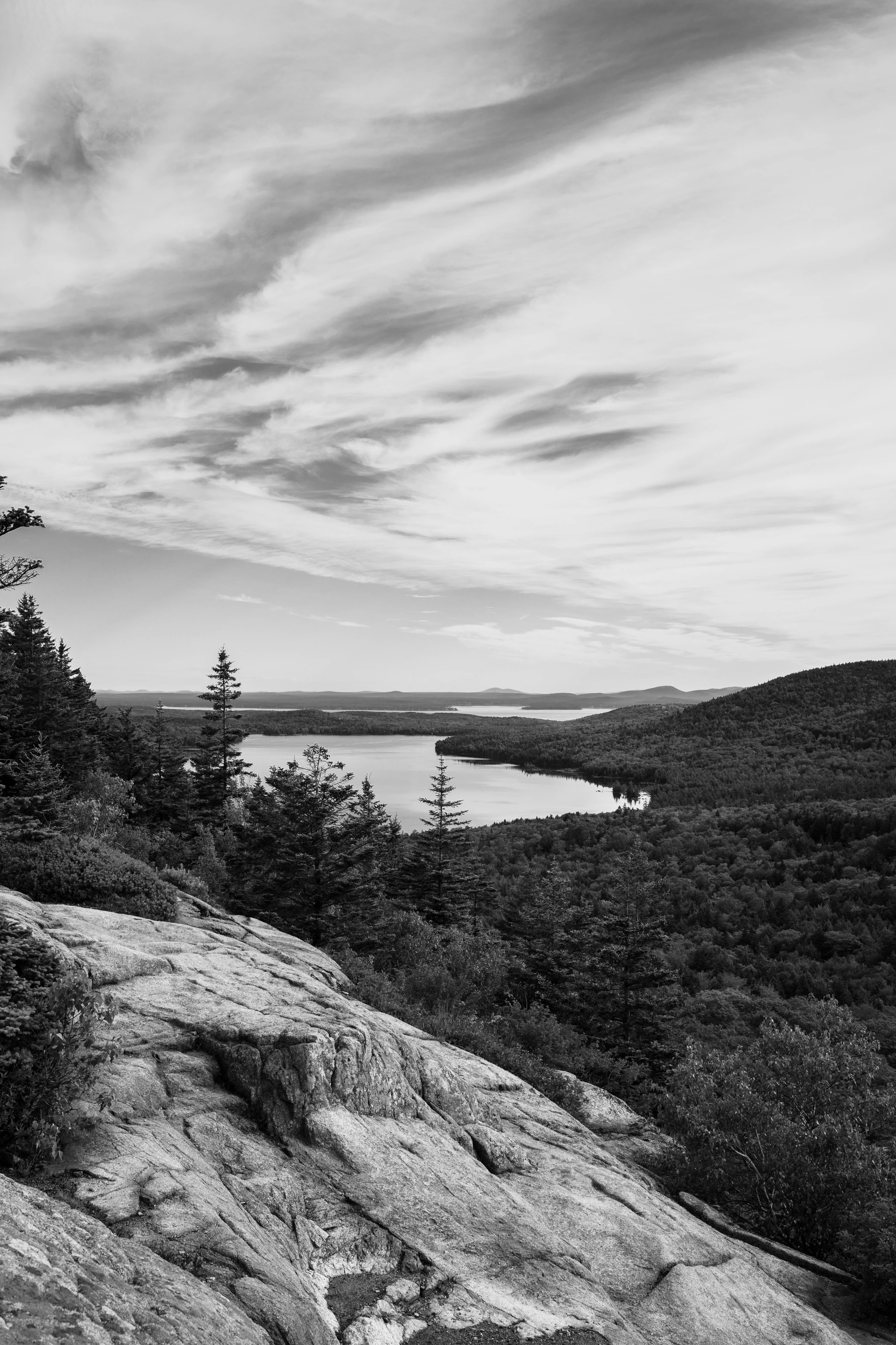 a rocky cliff overlooking a lake