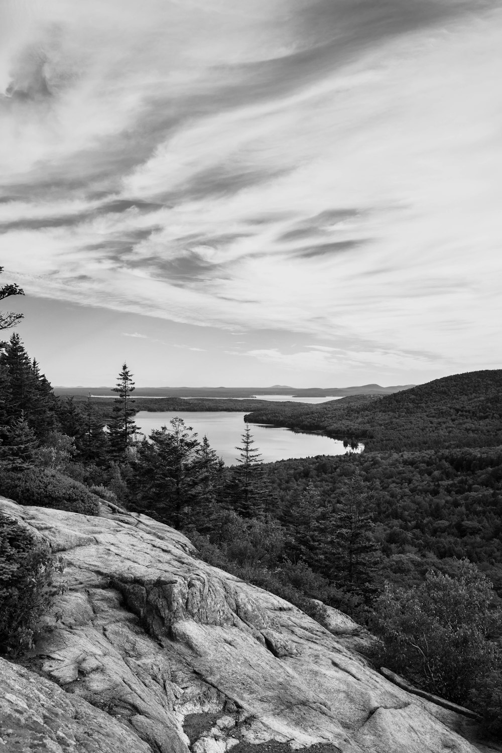 a rocky cliff overlooking a lake