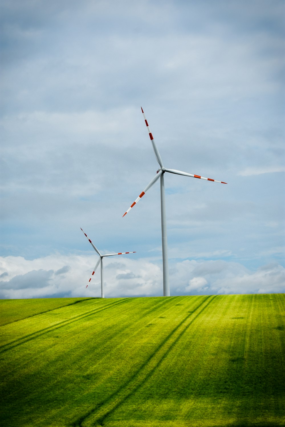 a group of wind turbines in a field