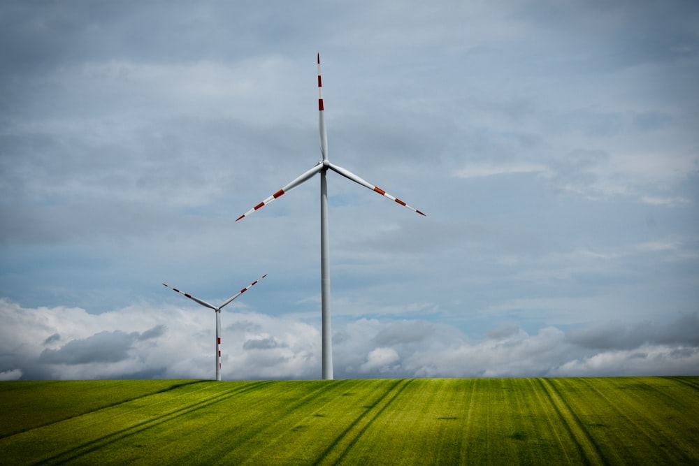 a windmill on a grassy hill