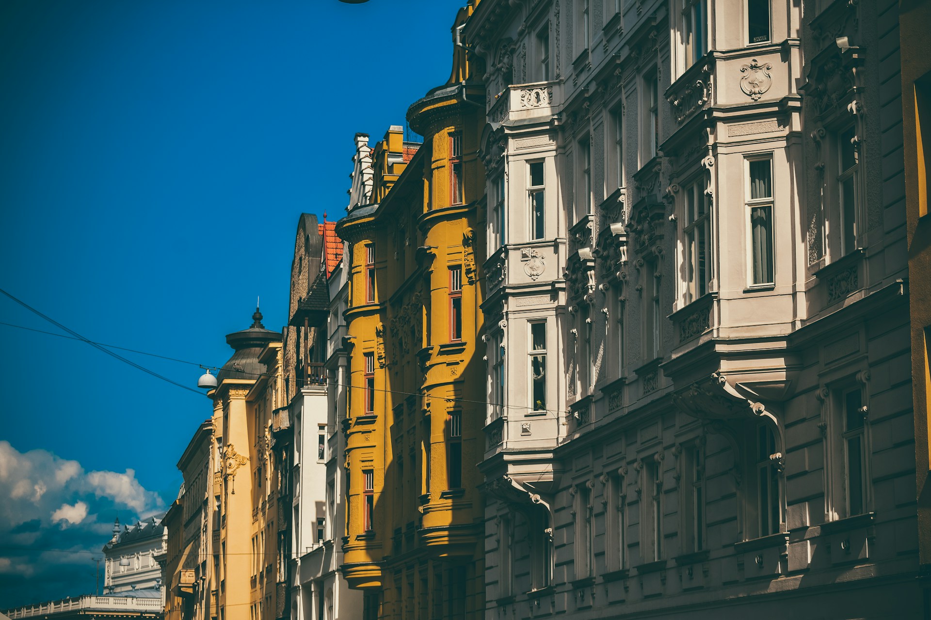 a row of buildings with a clock