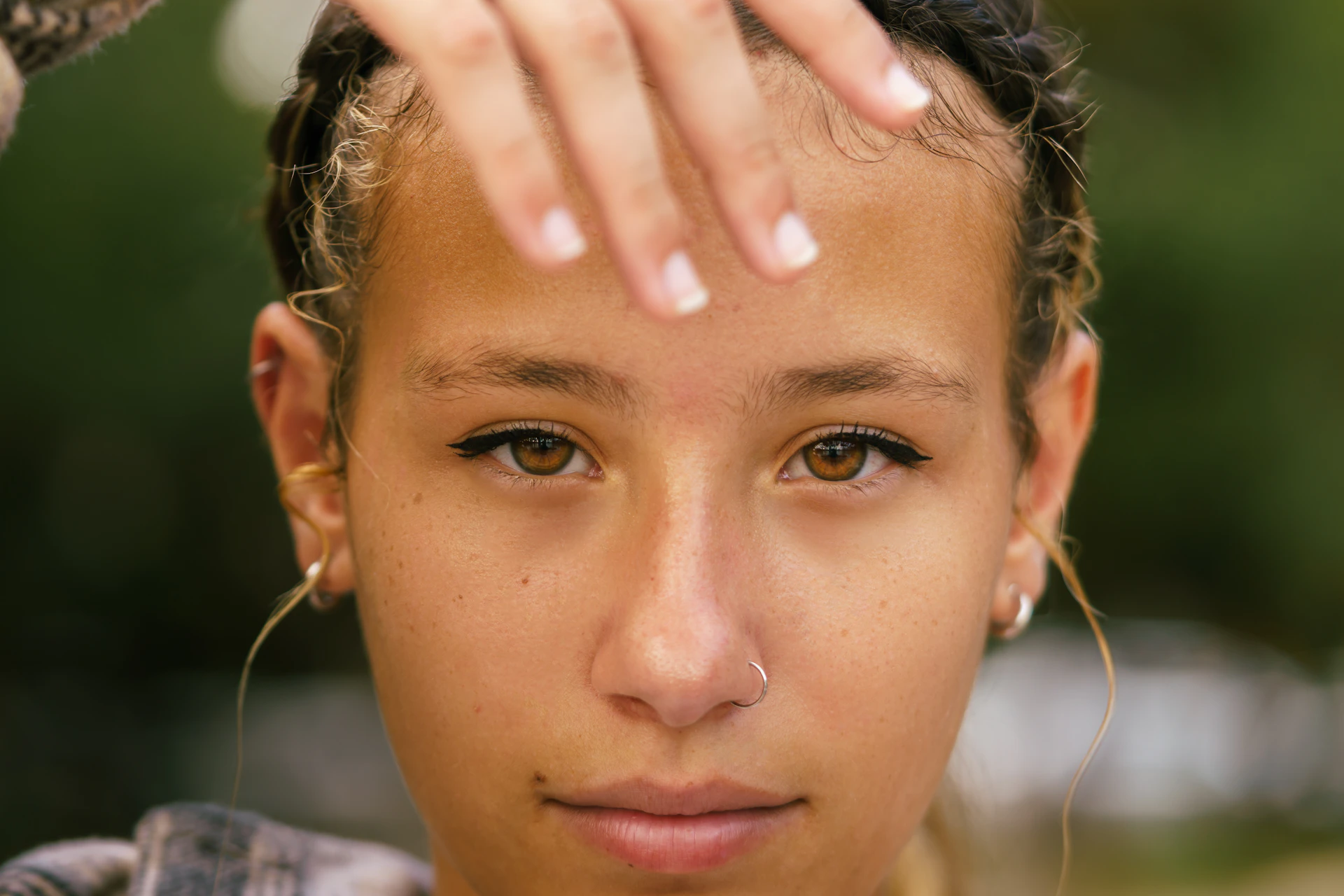 a woman with her hair pulled back