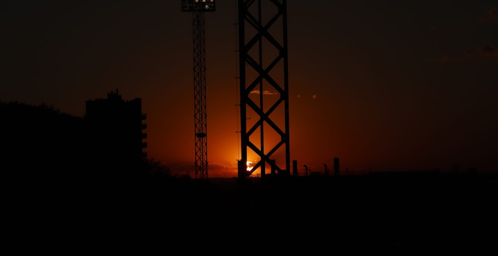 a silhouette of a crane at night