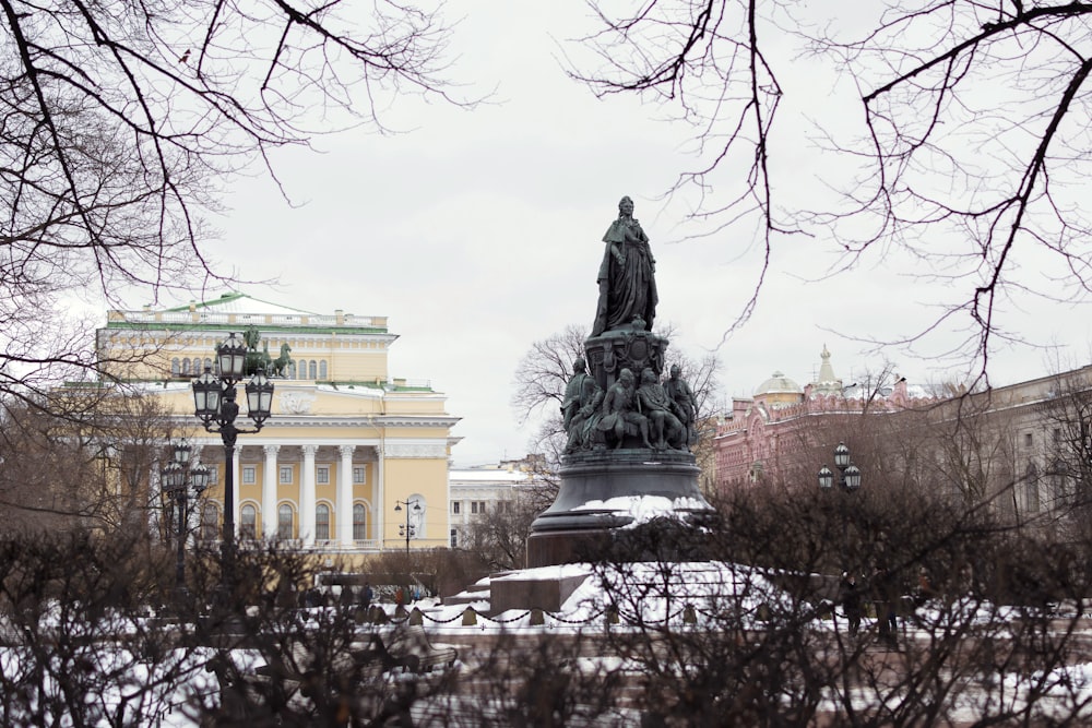 a statue in front of a building