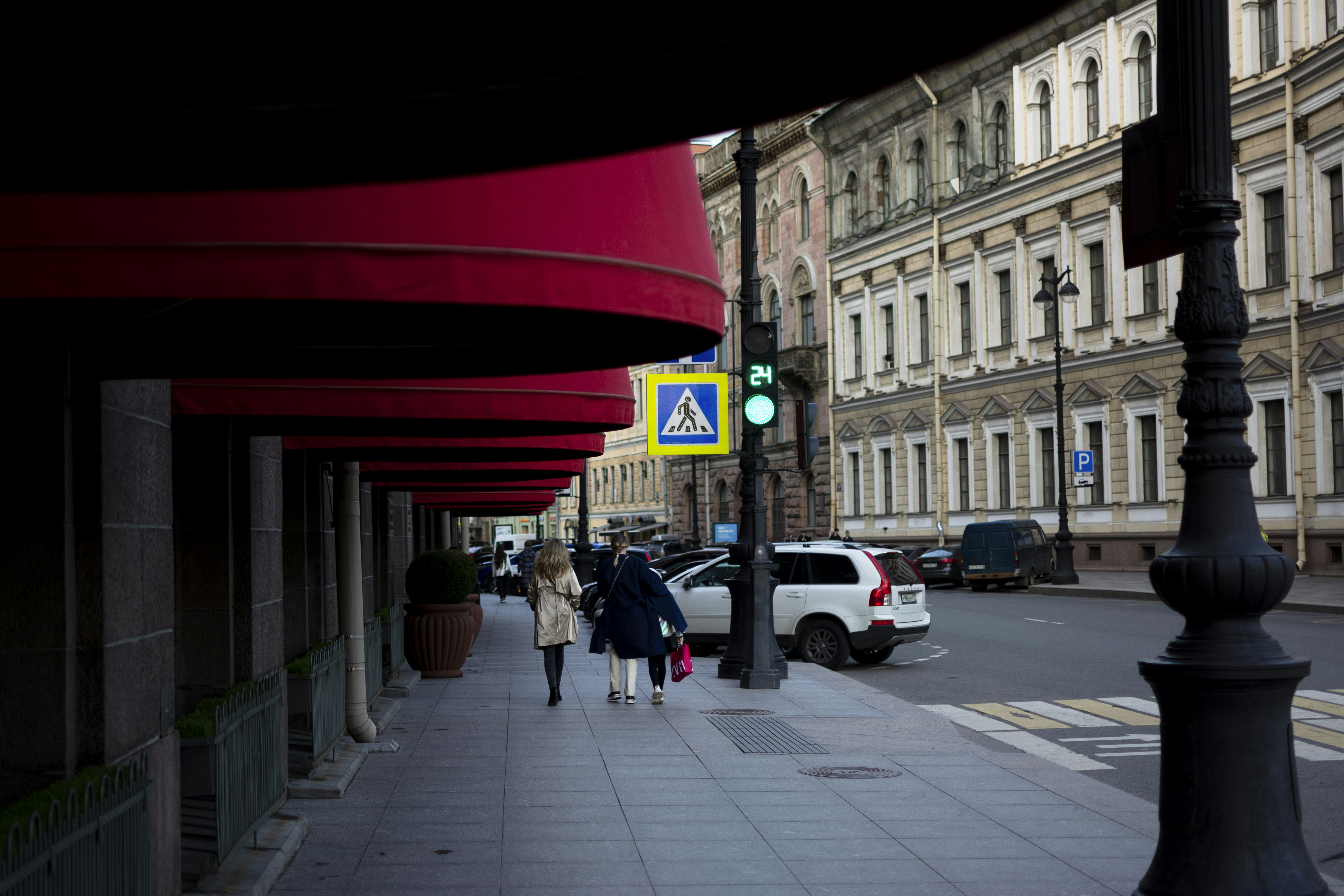 people walking on a sidewalk