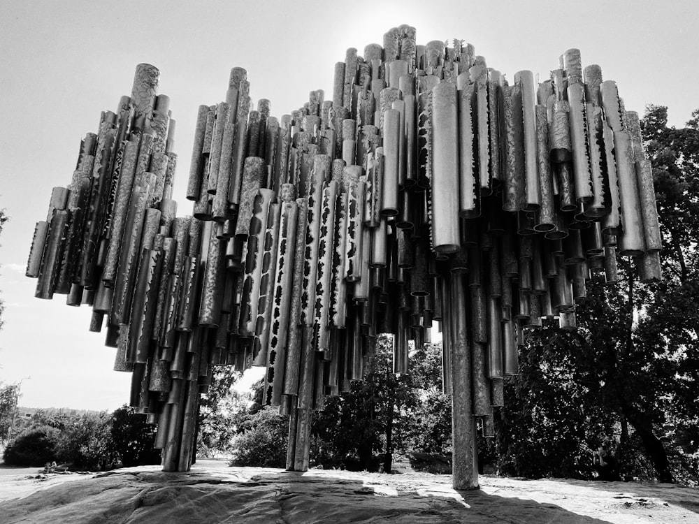 a large stone structure with Sibelius Monument in the background