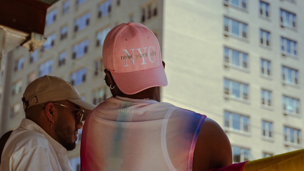 a man wearing a pink hat