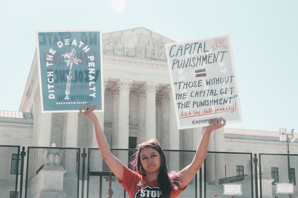 a man holding a sign