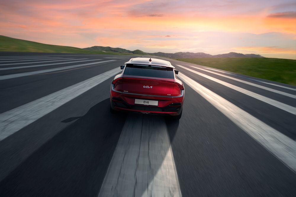 a red sports car on a road