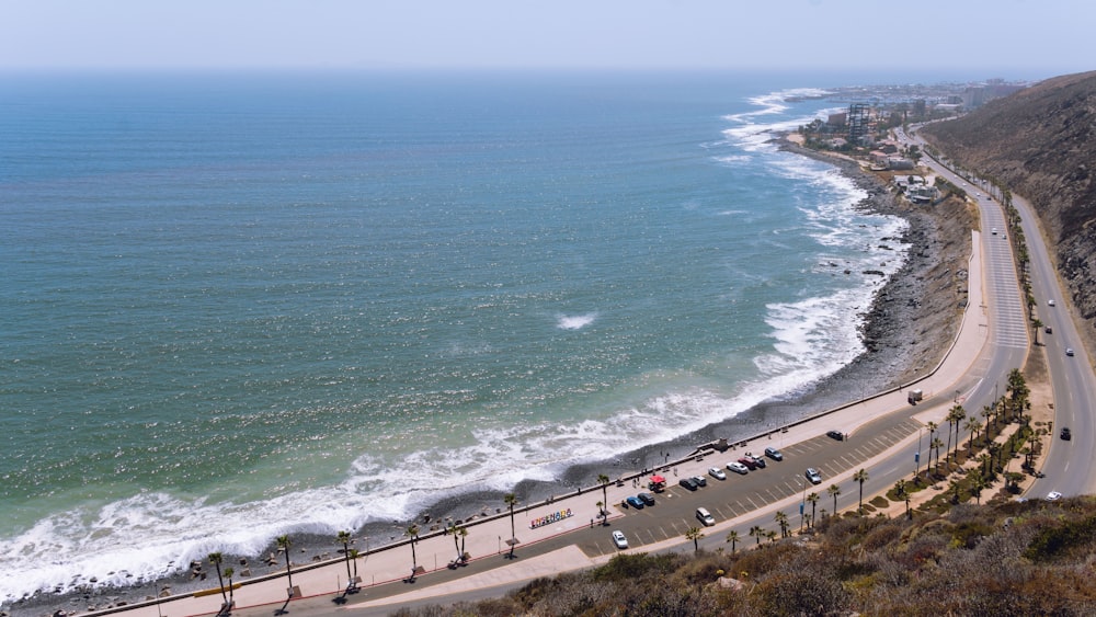 a beach with cars and people