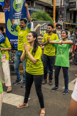 a group of people holding signs