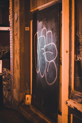 Nighttime shot of a Stilex steel door glowing subtly with ambient lighting, emphasizing luxury and security.