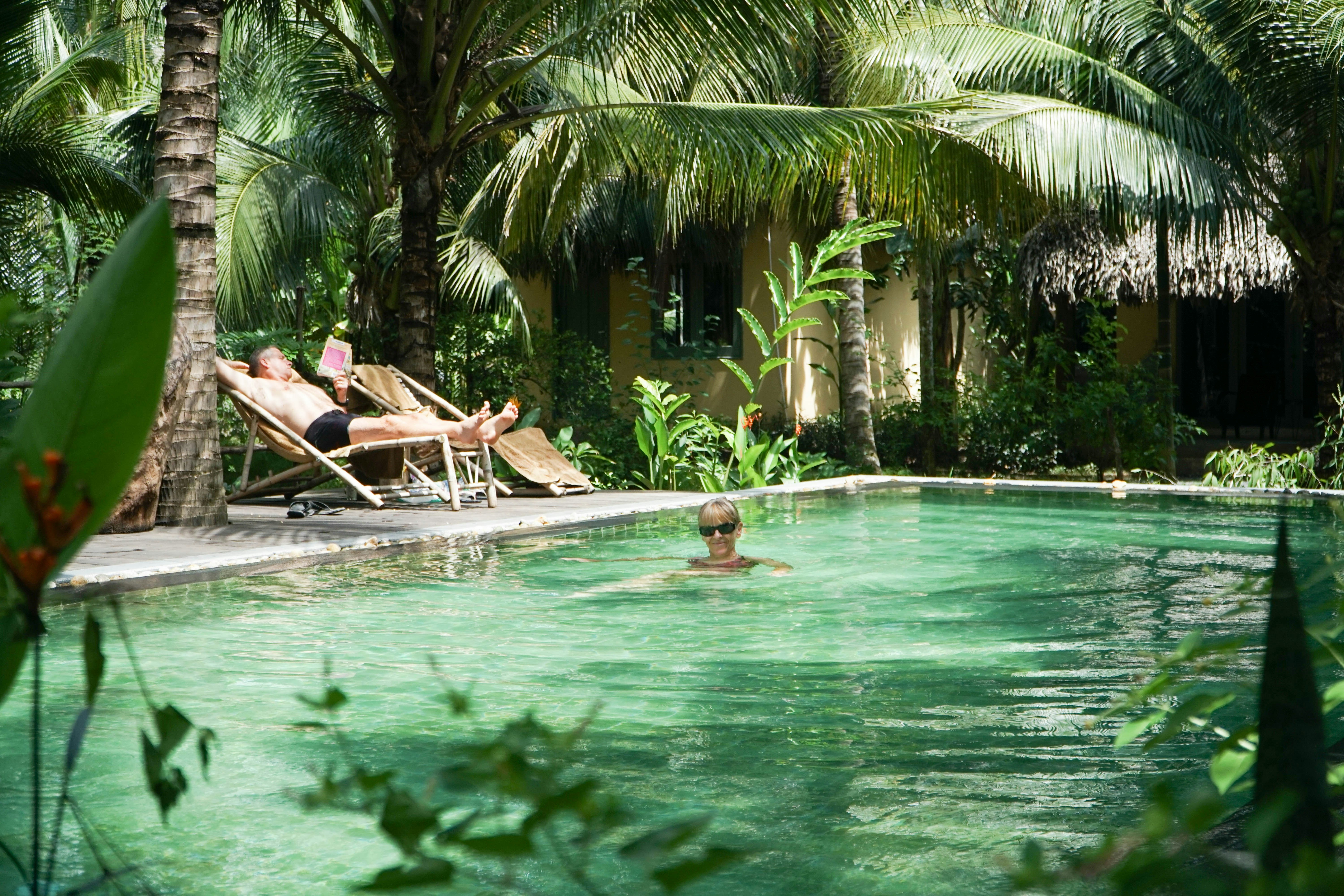 a group of people sitting in a pool