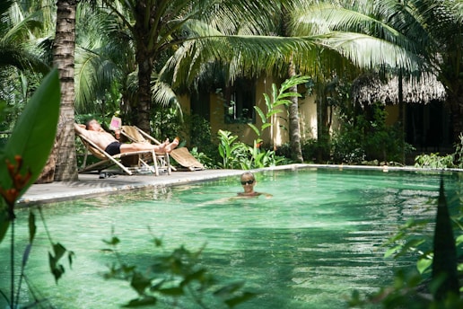 a group of people sitting in a pool