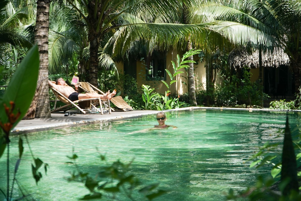 a group of people sitting in a pool