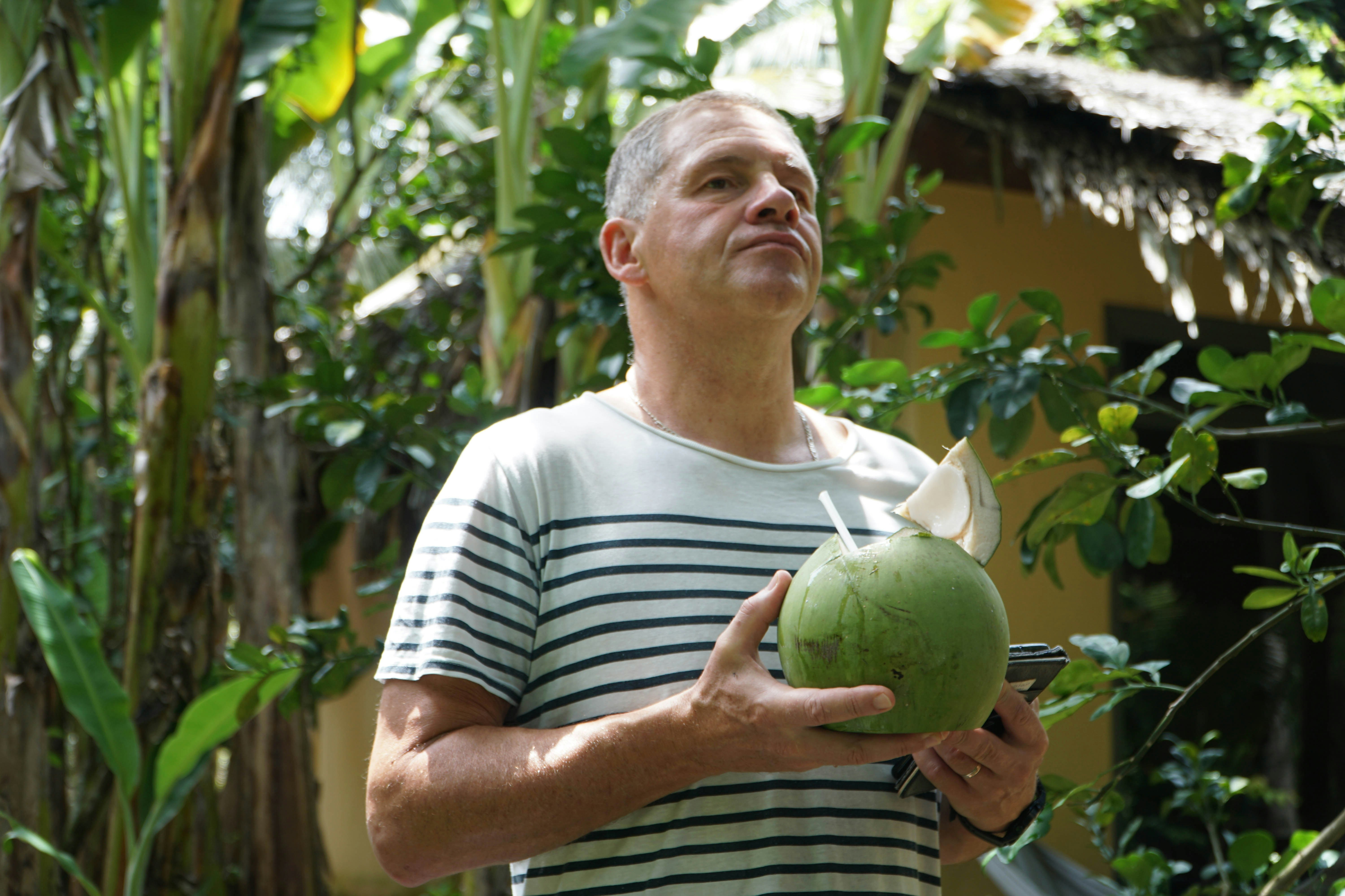 a person holding a watermelon