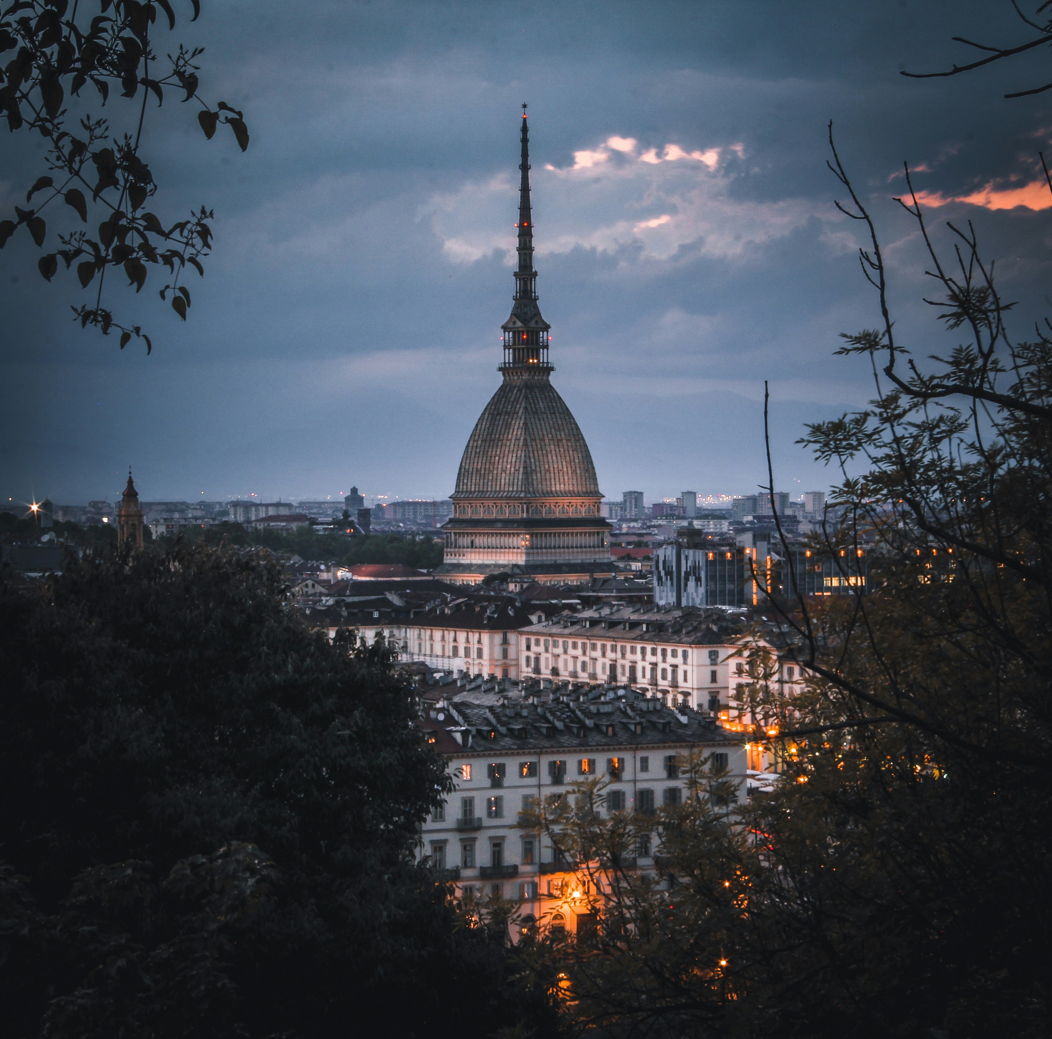 a large building with a dome and a tower in the background