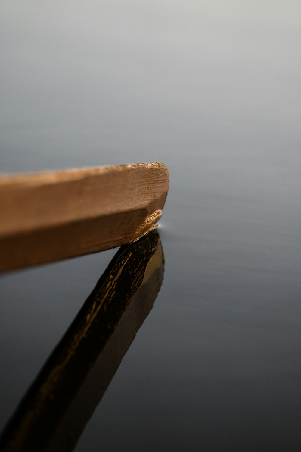 a wooden object on a surface