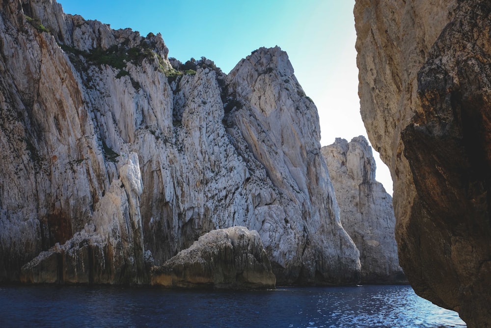 a body of water with large rocks