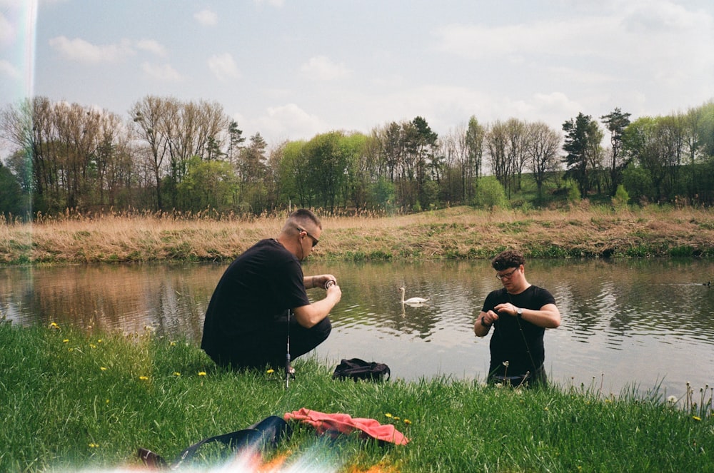 two men fishing in a river