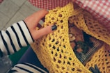 a person holding a piece of food