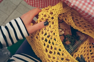 a person holding a piece of food