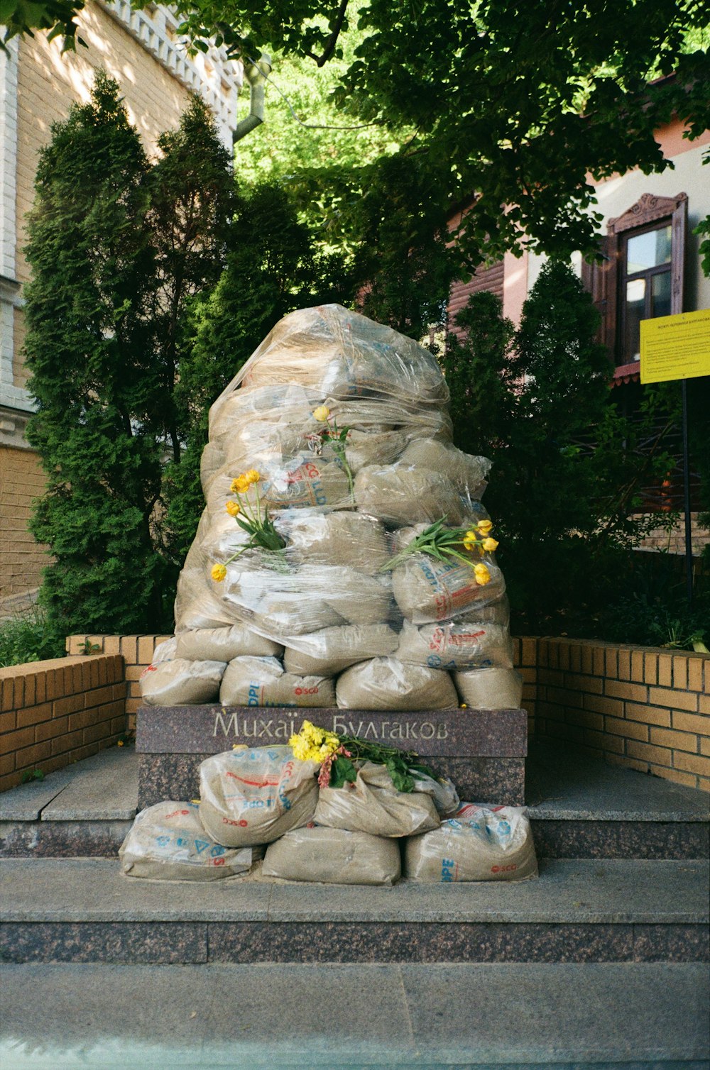 a statue of a person with flowers