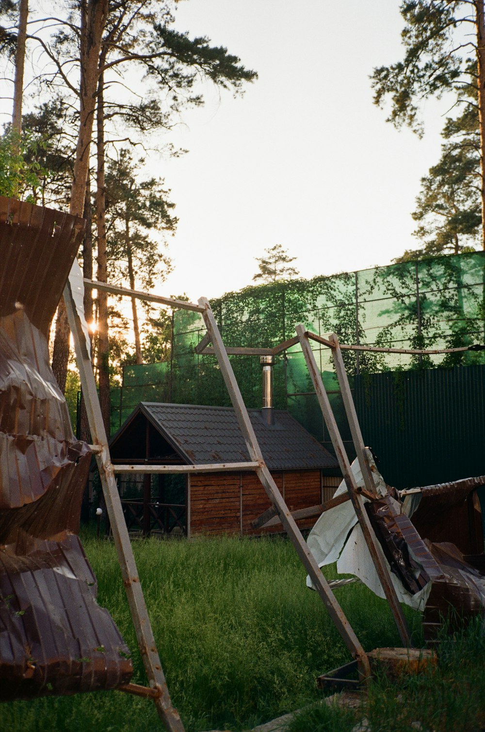 a wooden house with a fence around it