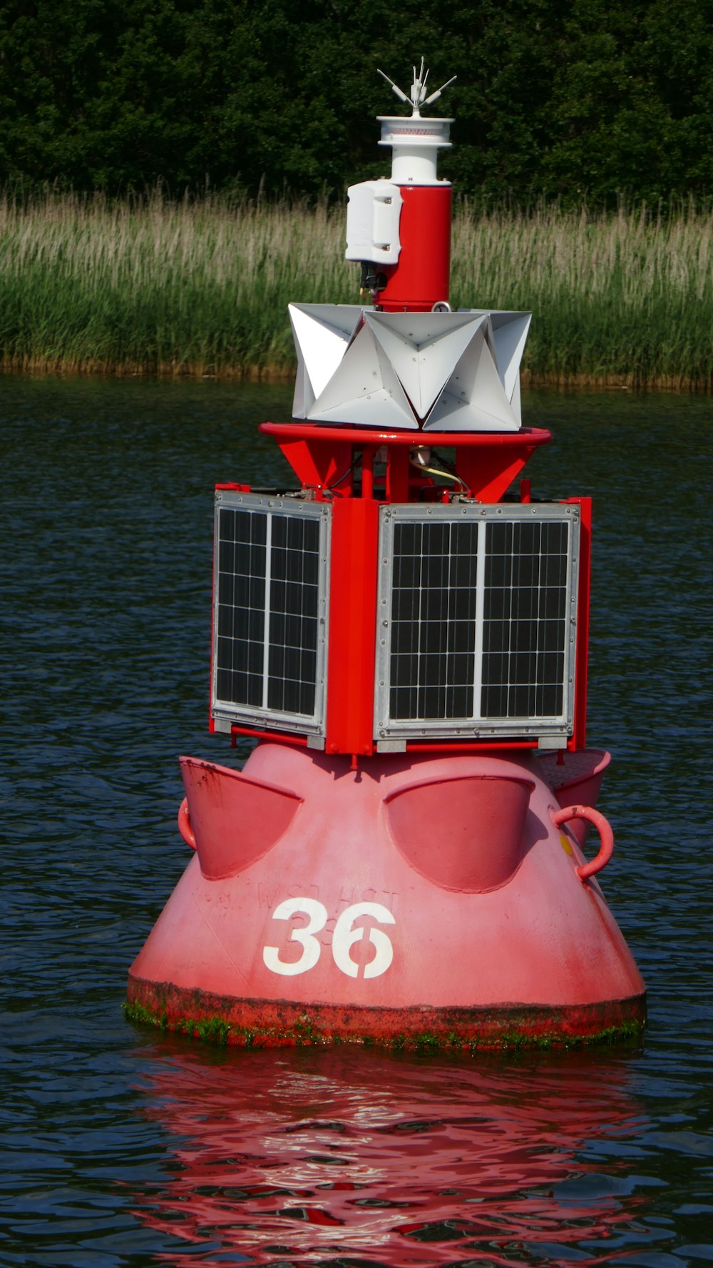 a red and white boat in the water