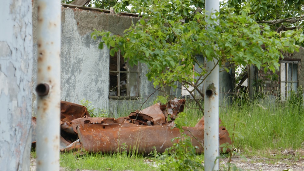a rusty car in a yard