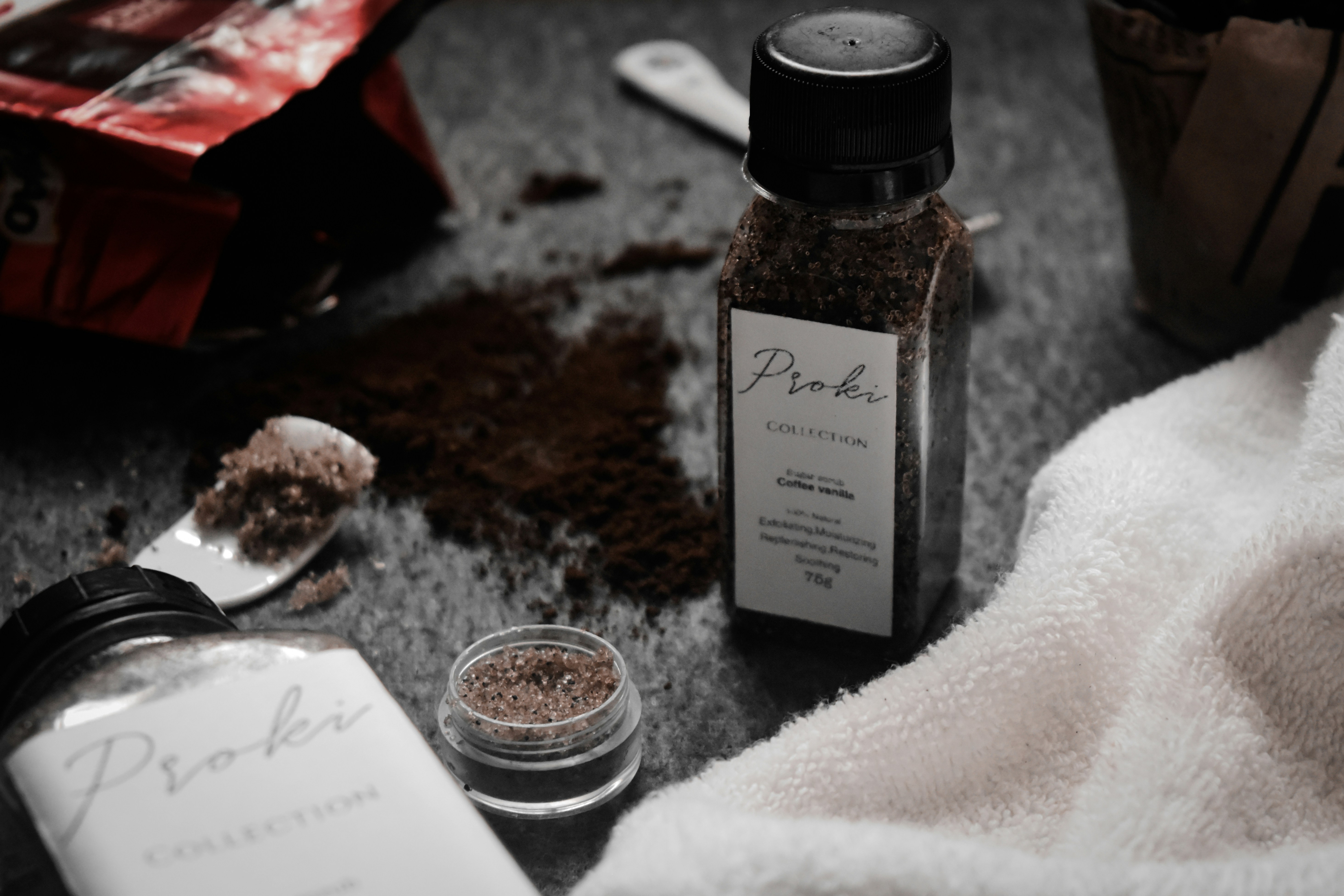 a bottle of liquor and a glass of water on a table