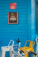 Bright blue and white walls with cheerful signage welcoming customers.