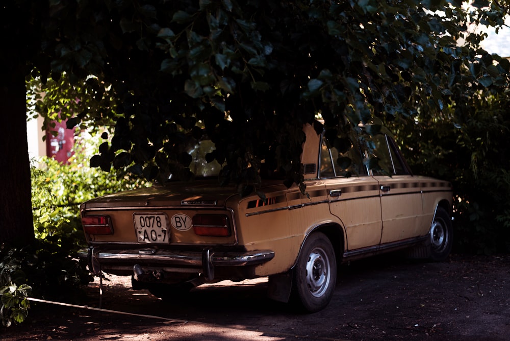 a truck parked under a tree