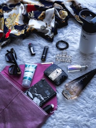 a variety of items are laid out on a bed