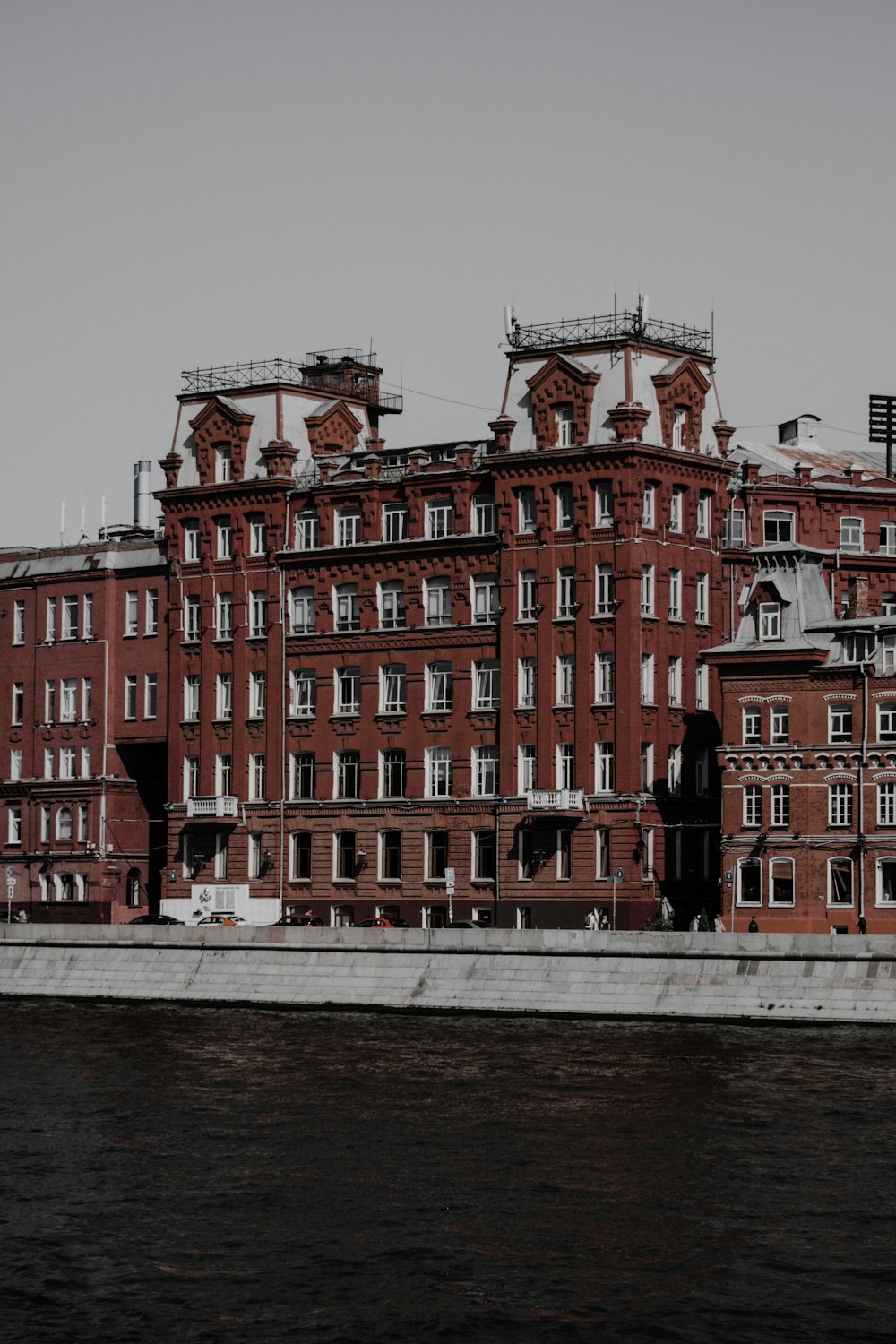 a large building with a body of water in front of it