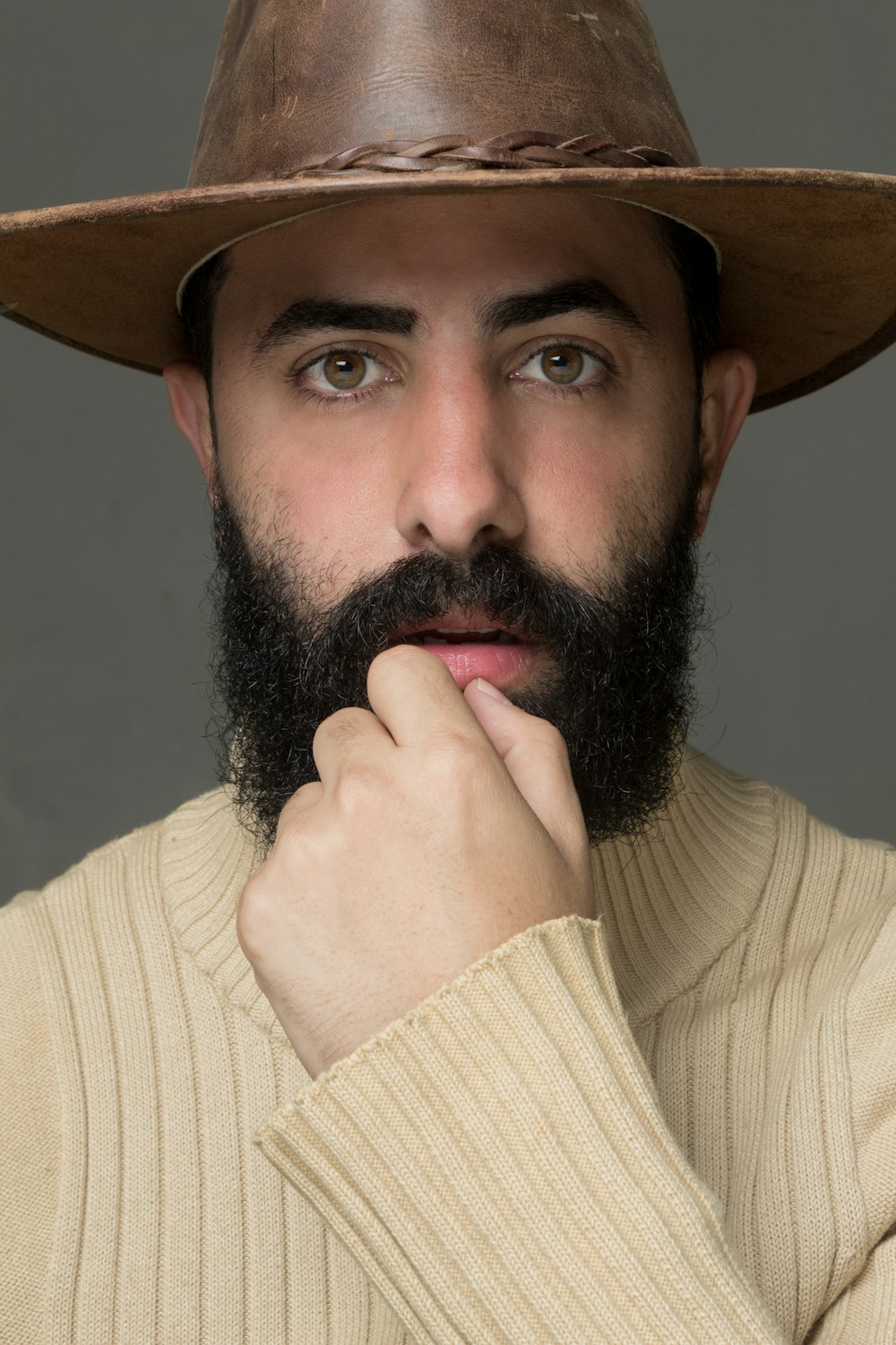 a man with a beard and a hat