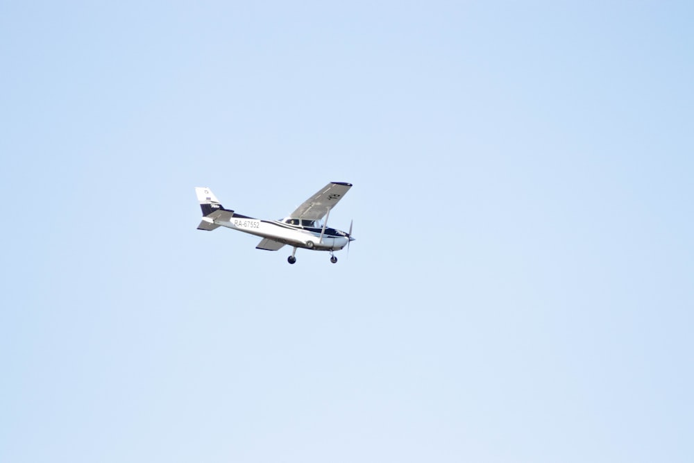 a small airplane flying in the sky