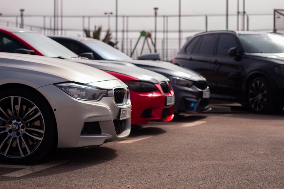 a group of cars parked in a parking lot