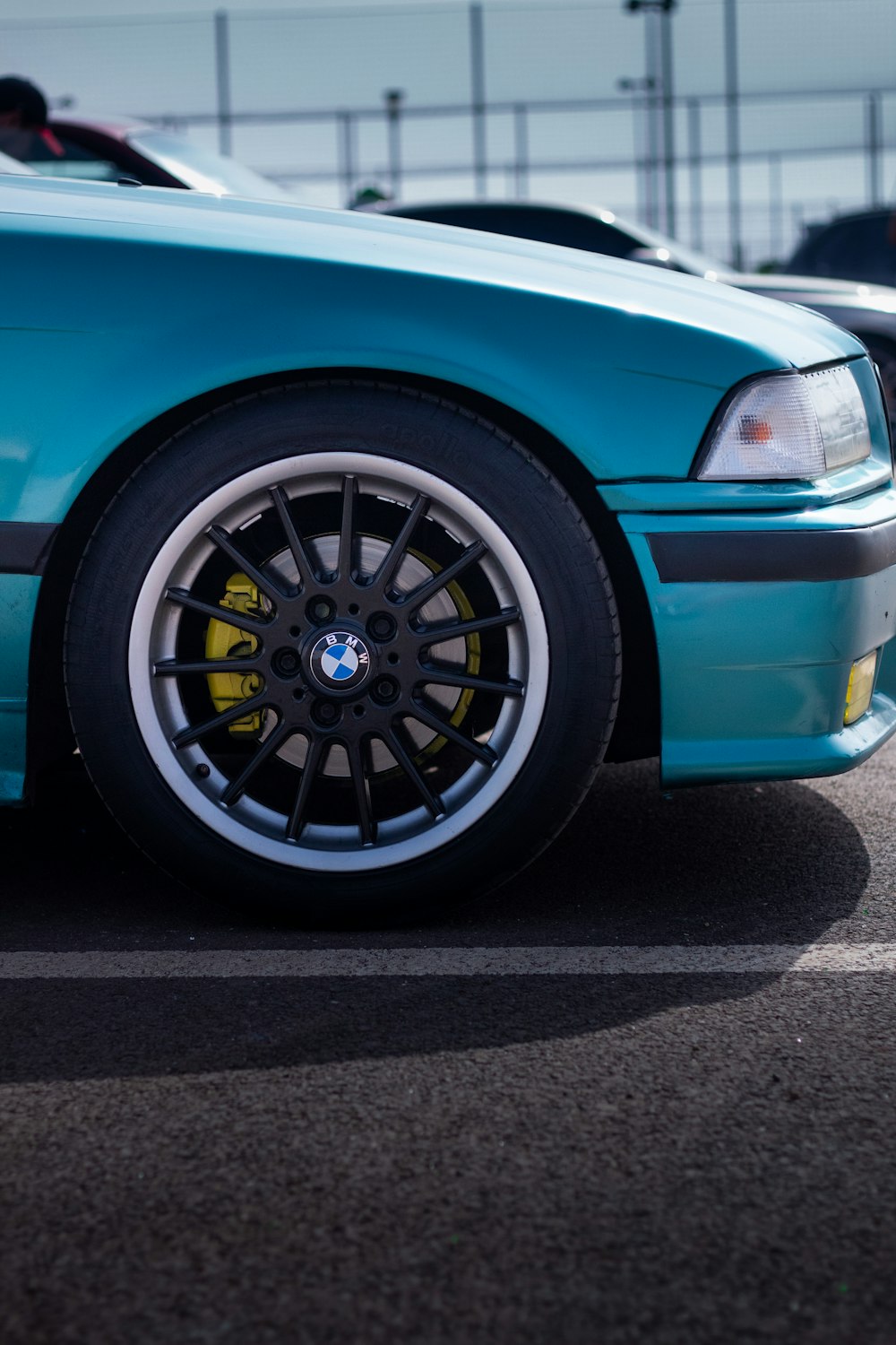 a blue car with a black rim