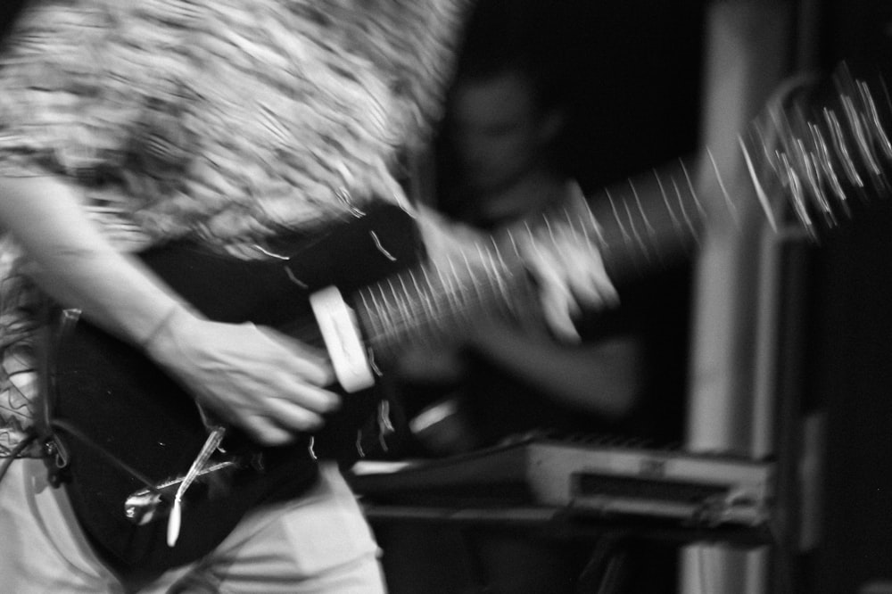 a man playing a guitar