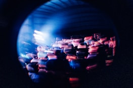 Abstract glitch effect overlay on a crowd dancing intensely to fast-paced techno music in Caracas.