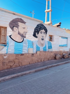 a wall with a mural of men