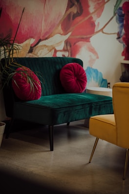 A compact modern loveseat in bold red, perfect for small spaces.