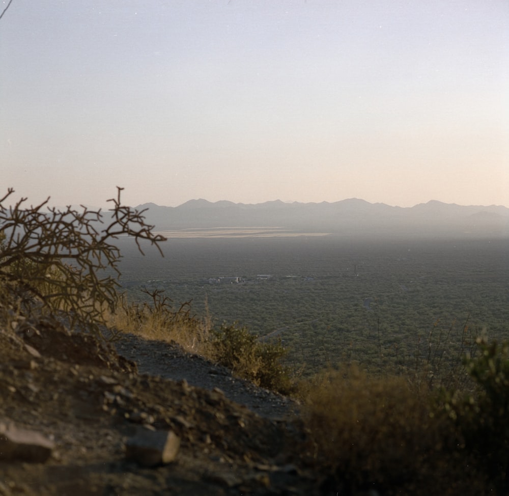 a body of water with hills around it