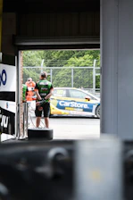 Close-up of a member receiving a special race day gift package at the track.